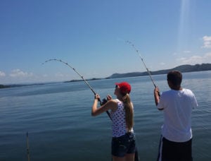 Young couple fishing in Cherokee Lake in East Tennessee