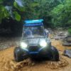 blue ATV in muddy water in campbell county