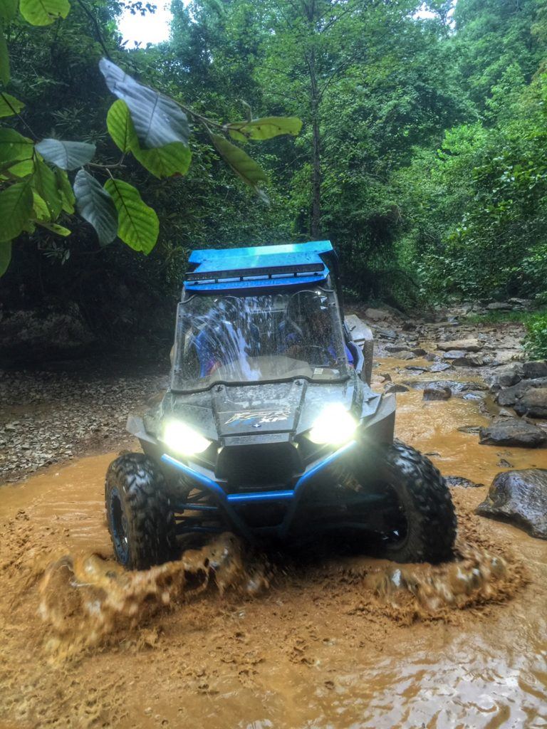 blue ATV in muddy water in campbell county